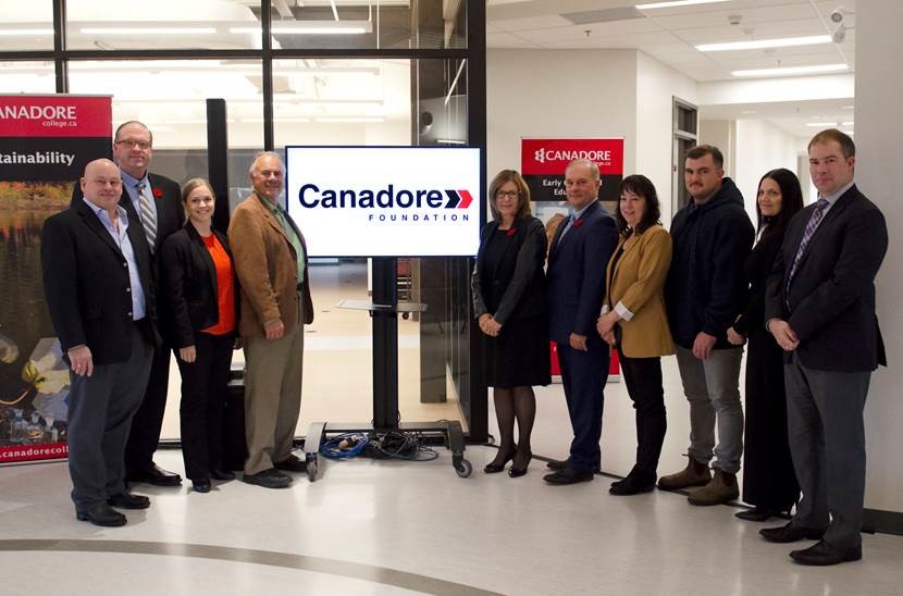 President George Burton joins Canadore College Foundation Board in a group photo with the New Canadore Foundation brand.